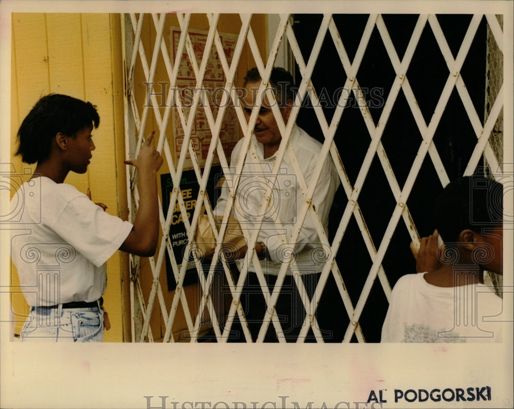 1990 Press Photo Neighborhood Food Liquor Security Gate - RRW03421 - Historic Images