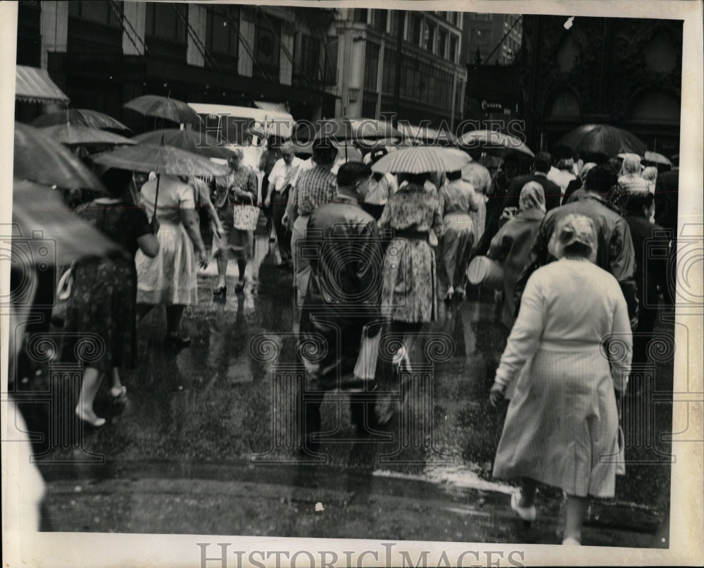 1961 Press Photo Pedestrians Raincoats Umbrellas - RRW04469 - Historic Images