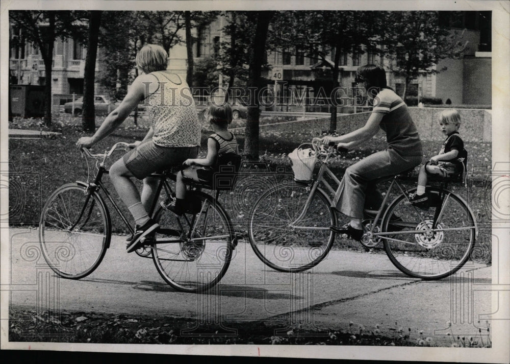 1975 Cycling lake front family affair baby-Historic Images