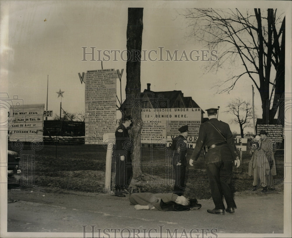 1954 Press Photo Chris laying on road outside fort. - RRW05691 - Historic Images