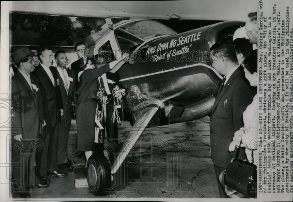 1958 Press Photo Mrs.Carlos Garcia Christens Gift Plane - RRW05945 - Historic Images