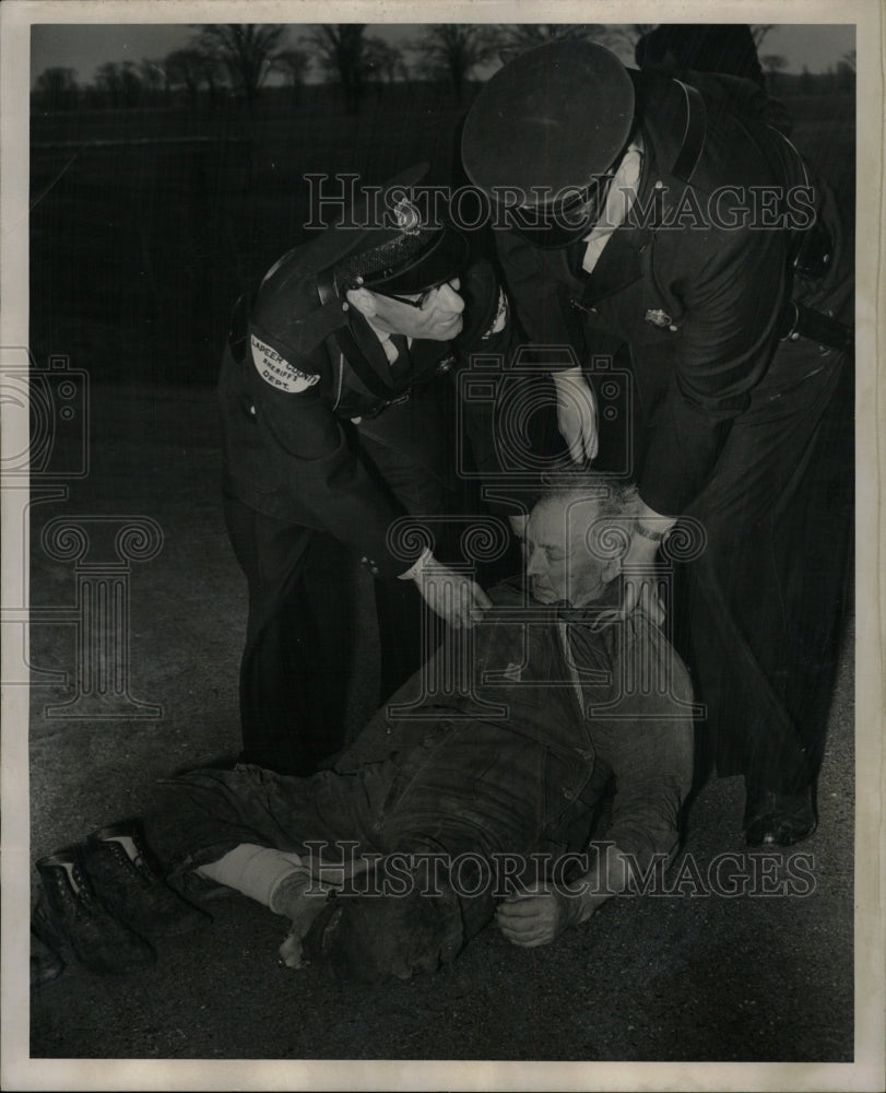 1954 Press Photo Deputies lay Chris pavement lapeer - RRW13121 - Historic Images