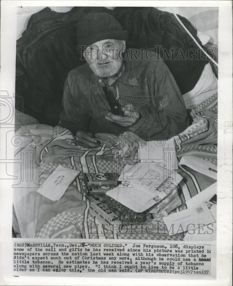 1957 Press Photo 108 Yr Old Man Showing Christmas Gifts - RRW29227 - Historic Images