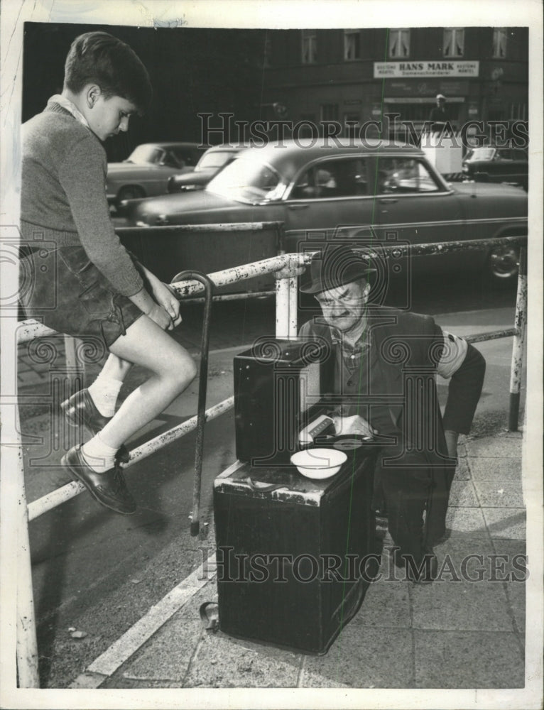 1957 Press Photo Blind Organ Grinder Now Uses Radio - RRW35111 - Historic Images