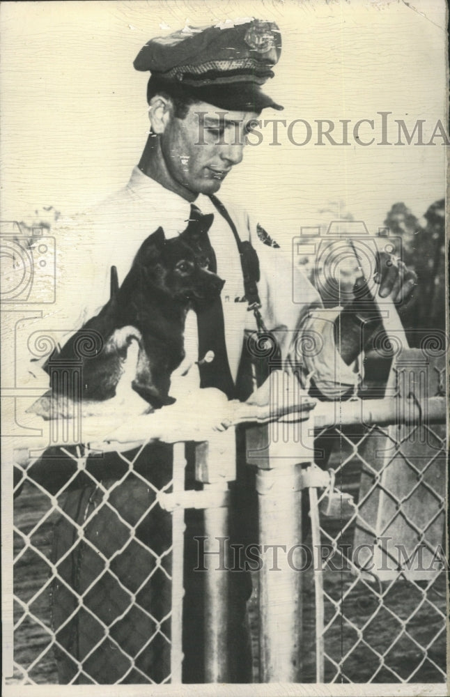 1957 Press Photo Herbert Keith Holds Friendly Pooch - RRW35411 - Historic Images