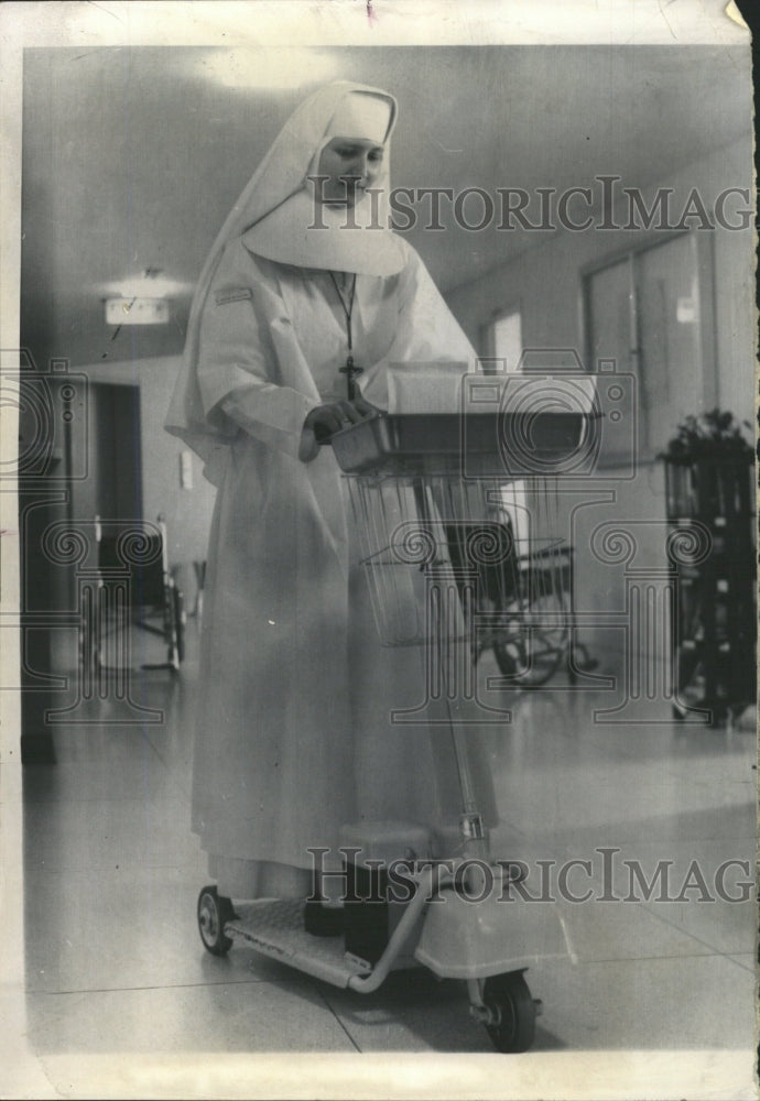 1965 Press Photo Nun Rides Scooter to Deliver Medicine - RRW39529 - Historic Images