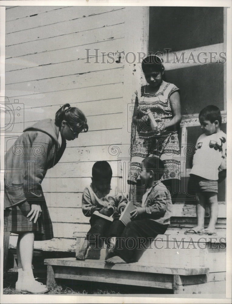 1964 Press Photo Migrant Children Smile Peace Corp Book - RRW45183 - Historic Images