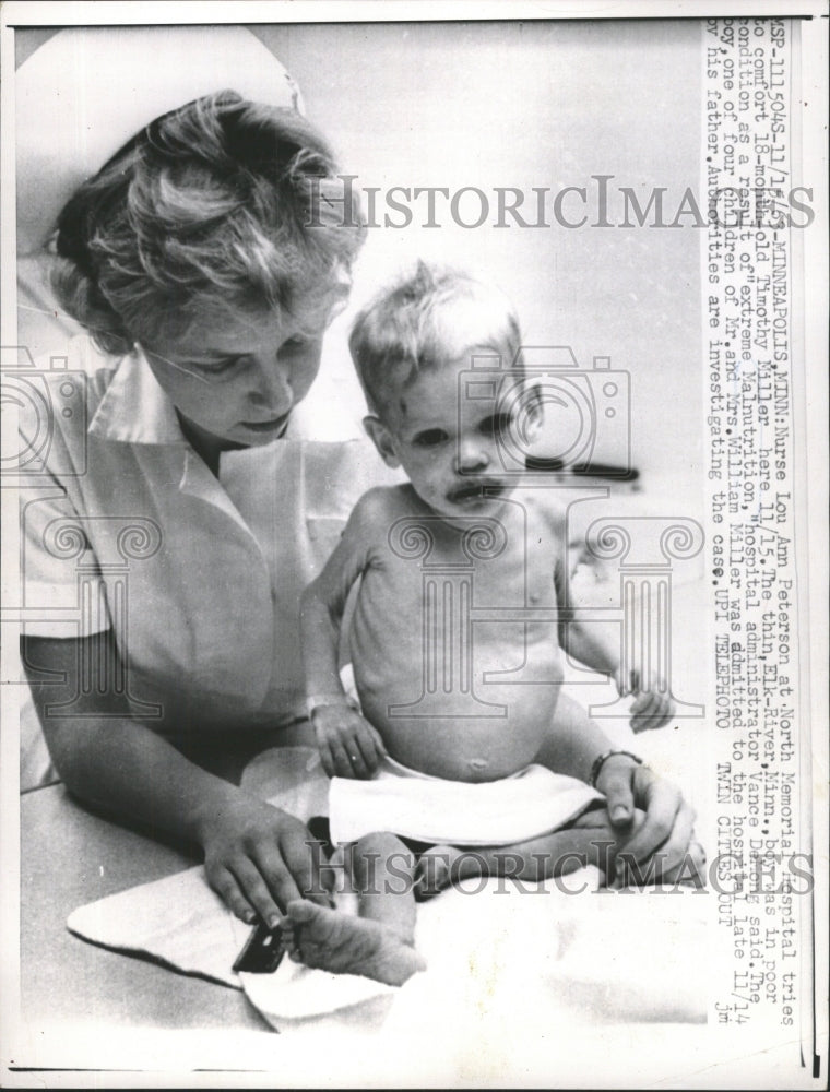 1963 Press Photo Nurse Lou Ann Peterson Comforts Baby - RRW46819 - Historic Images