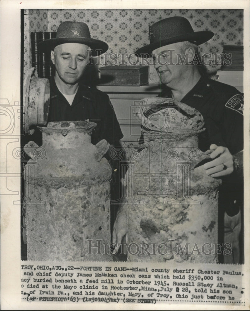 1963 Press Photo Fortune Cans Found at Feed Mill - RRW47119 - Historic Images