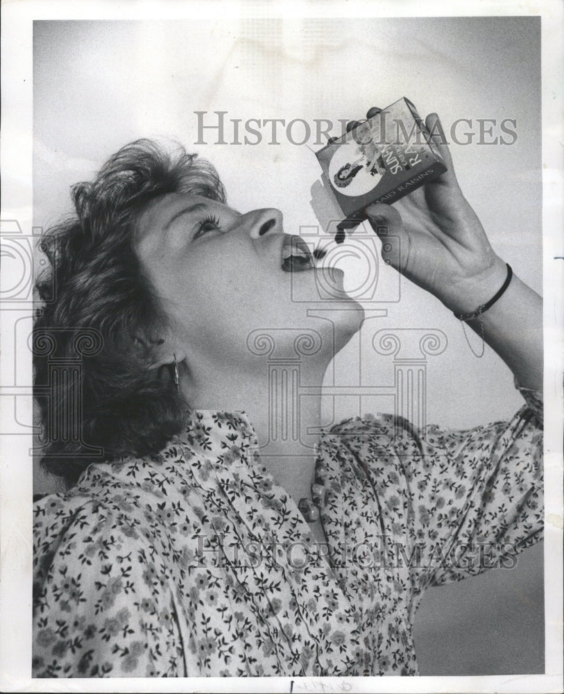 1976 Press Photo Woman Enjoying Sunmaid Raisins - RRW47947 - Historic Images