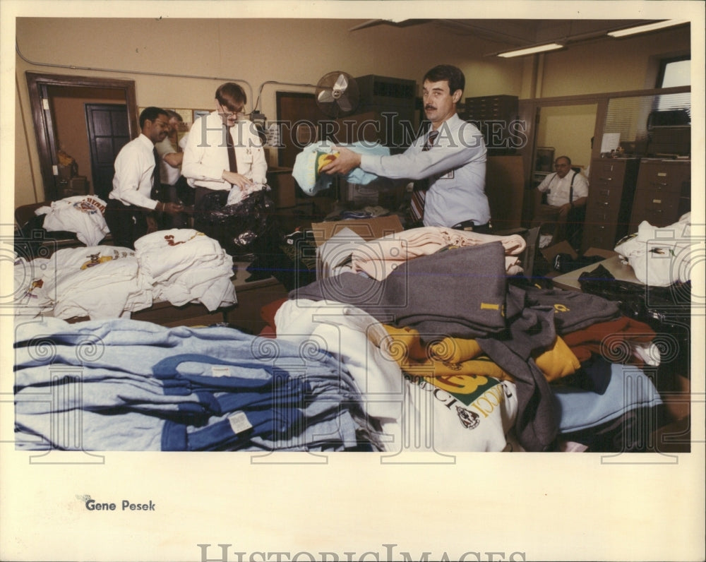 1990 Press Photo Police Counterfeit Shirts - RRW54395 - Historic Images