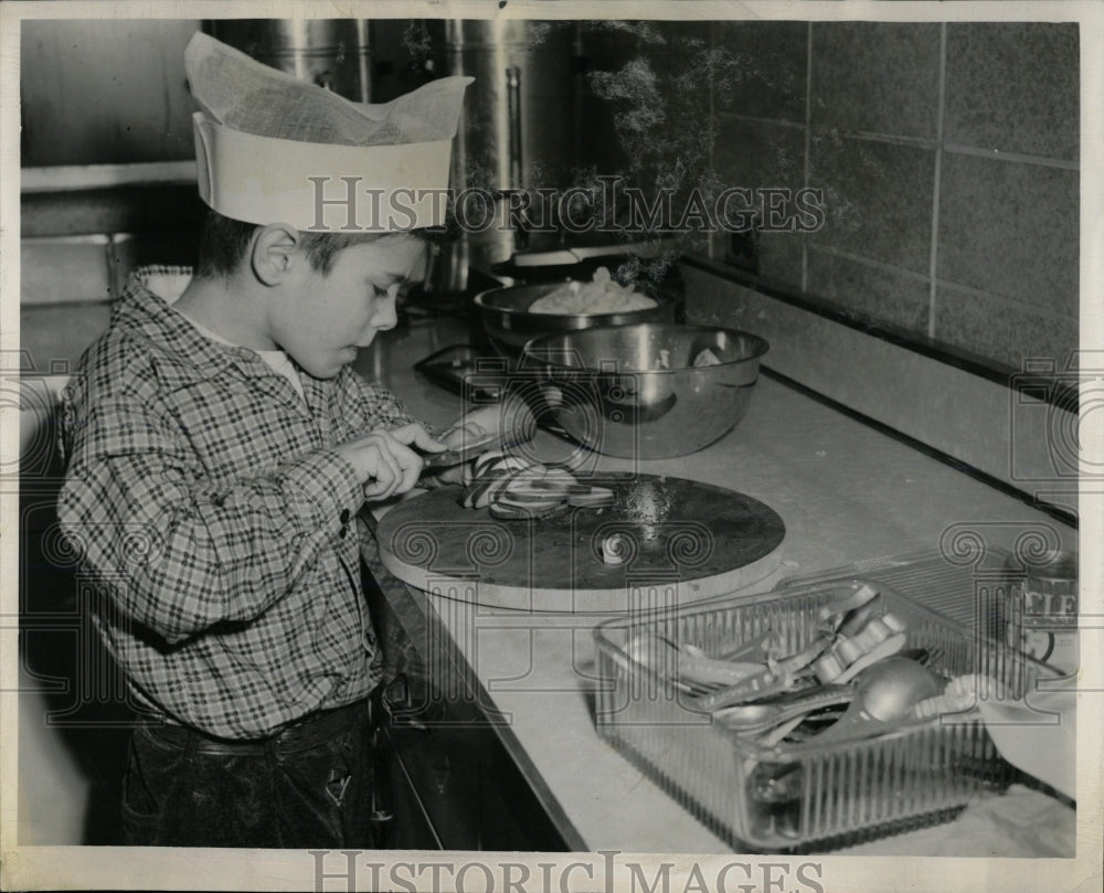 1954 Press Photo Joel Stein cuts Cucumber for Dinner. - RRW60263 - Historic Images