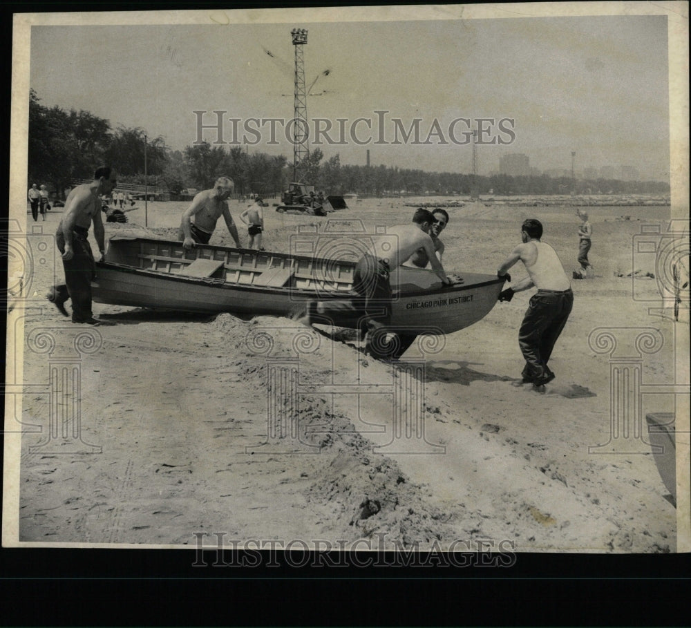 1957 Press Photo Crew Pushes Craft into Lake Michigan - RRW60893 - Historic Images