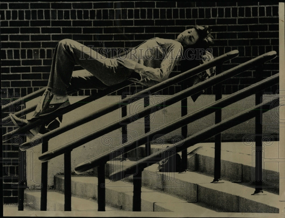 1974 Press Photo Woman Balancing On Hand Railings - RRW63119 - Historic Images