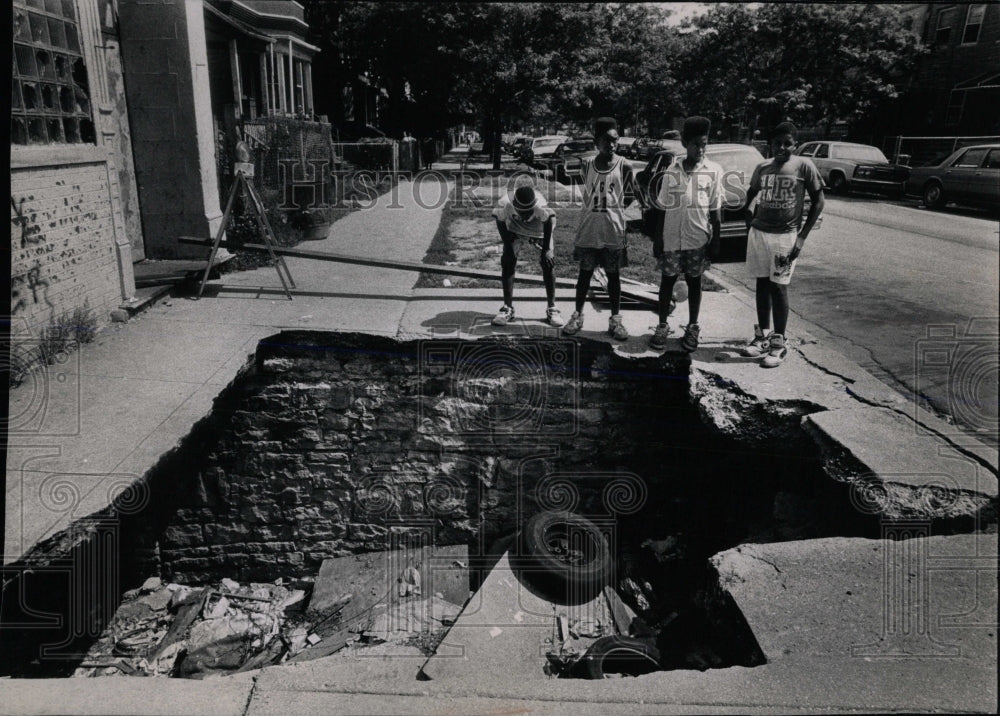 1990 Press Photo Caved-In Section Of Pavement Upsetting - RRW65857 - Historic Images