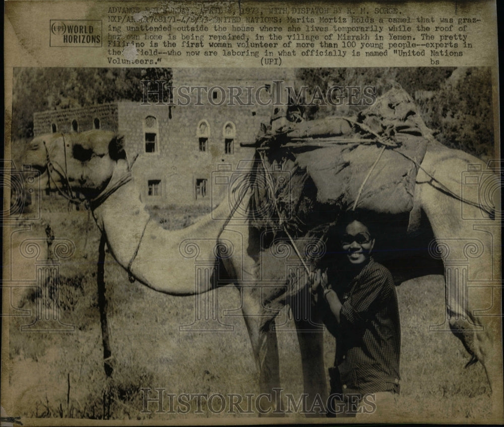 1973 Press Photo Marita Mortiz camel grazing house roof - RRW67347 - Historic Images