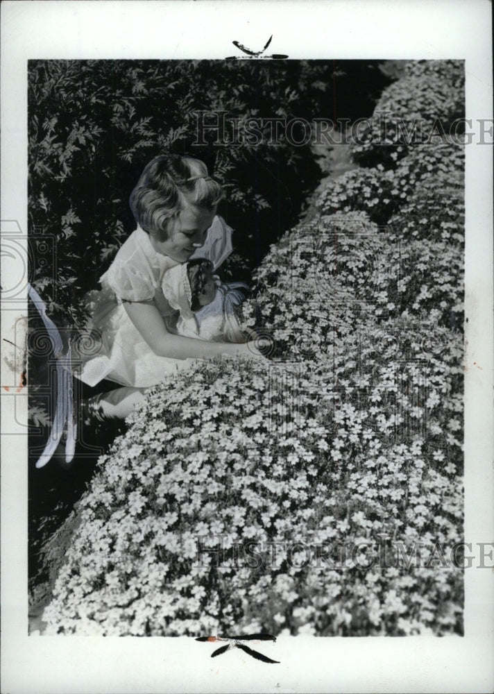 1974 Press Photo Marigold Flower Bushes Girl - RRW72015 - Historic Images