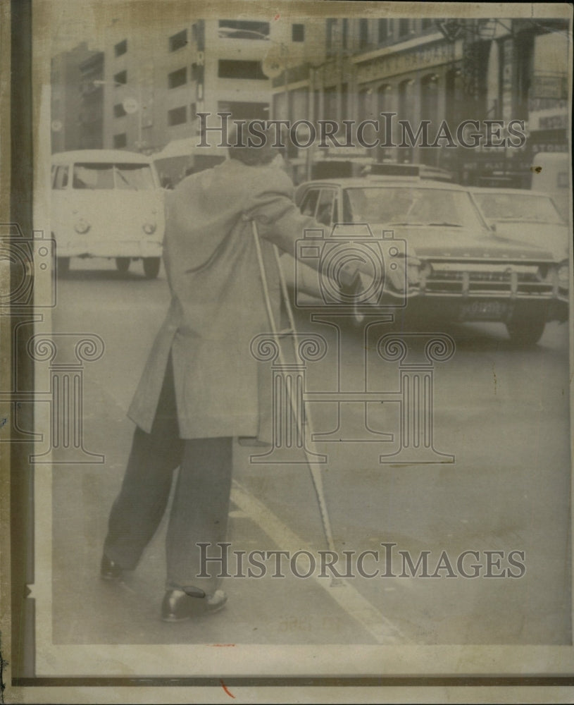 1966 Press Photo Man crutches-unable work Transit - RRW74907 - Historic Images