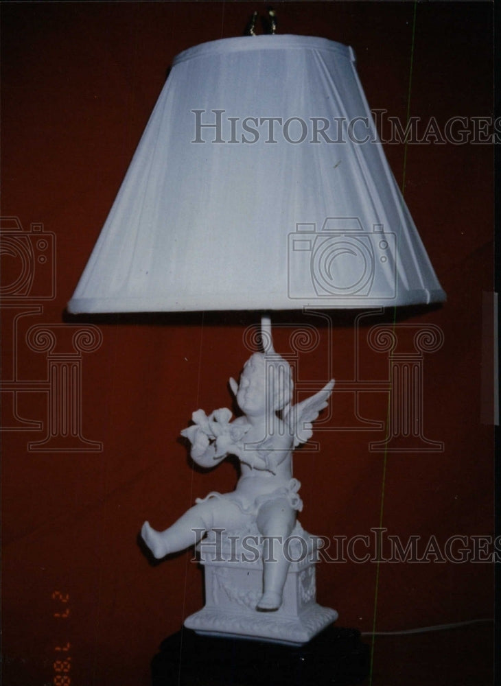 1996 Press Photo White Lamp With Cupid Figurine As Base - RRW76973 - Historic Images