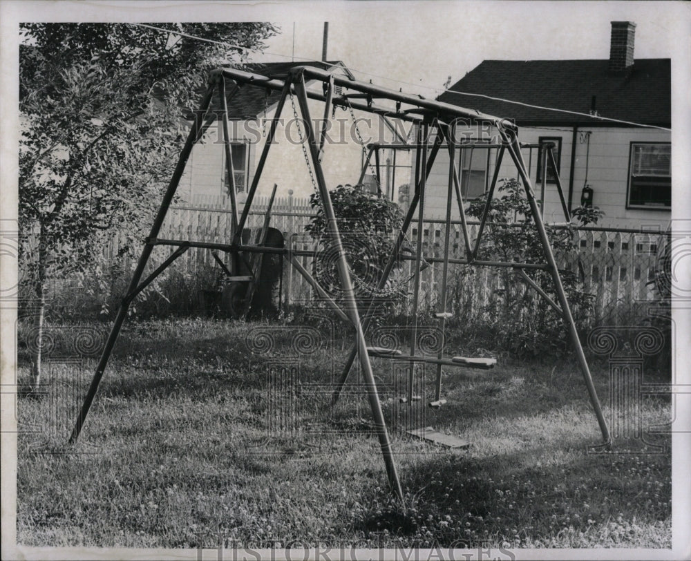 1957 Press Photo Gloria Daigneau House Backyard Swings - RRW83849 - Historic Images