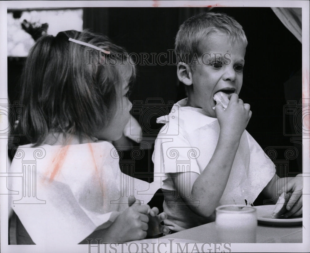 1956 Press Photo Riley Van Dyke tackles kids wiener - RRW87911 - Historic Images