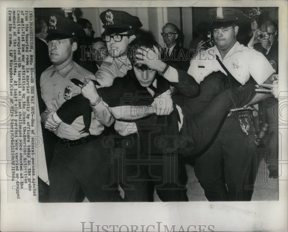 1966 Press Photo Several persons being carried out - RRW89859 - Historic Images