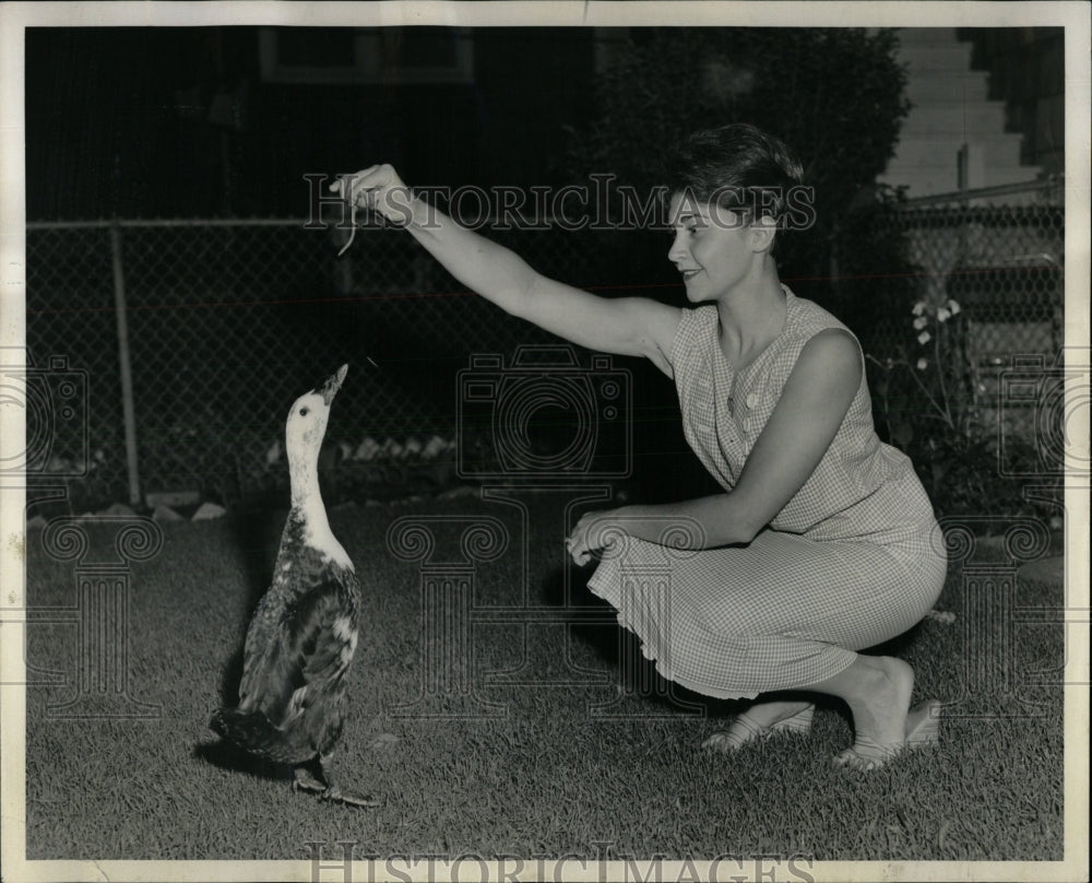 1958 Press Photo Mary Jo Nash plays with her duck. - RRW90263 - Historic Images