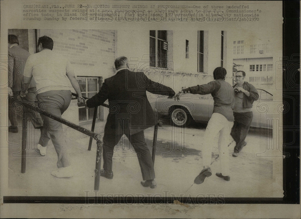 1970 Narcotic suspect swing US handcuffed - Historic Images