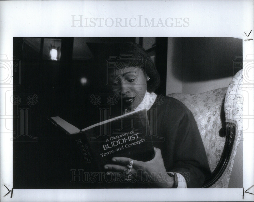 1992 Woman Reading Buddhist Dictionary - Historic Images