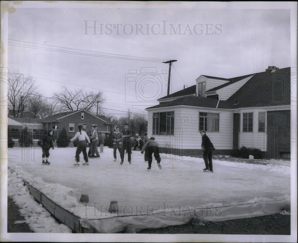 1959 People enjoying ice skating. - Historic Images