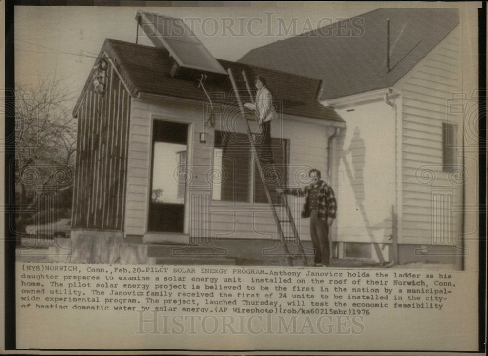 1976 House owner checks Solar energy System - Historic Images