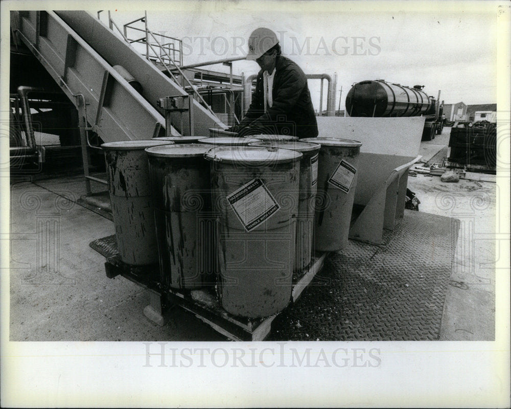 1982 Pat Doyle moving hazardous materials. - Historic Images