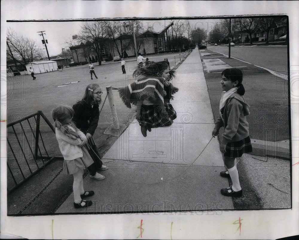 1975 LIttle Girls Jump Roading On Sidewalk - Historic Images