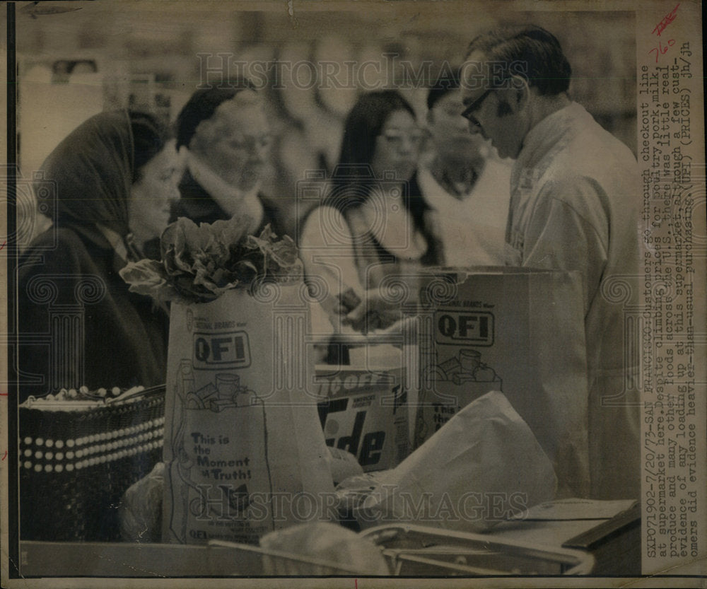 1973 Customers Go Through Checkout Line - Historic Images