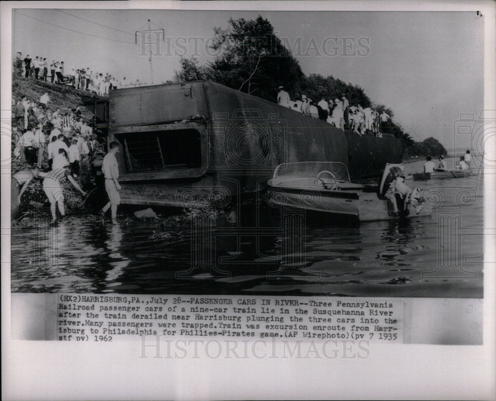 1962 Passenger car in the river - Historic Images