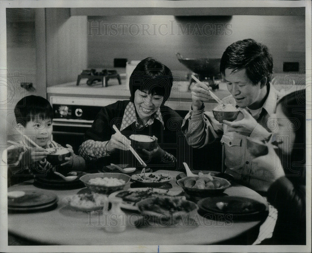 1976 Rhoda Yee and Family Eat - Historic Images