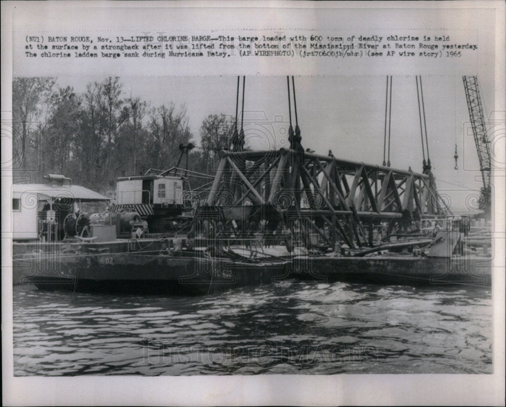 1965 Lifted chlorine barge from the river. - Historic Images