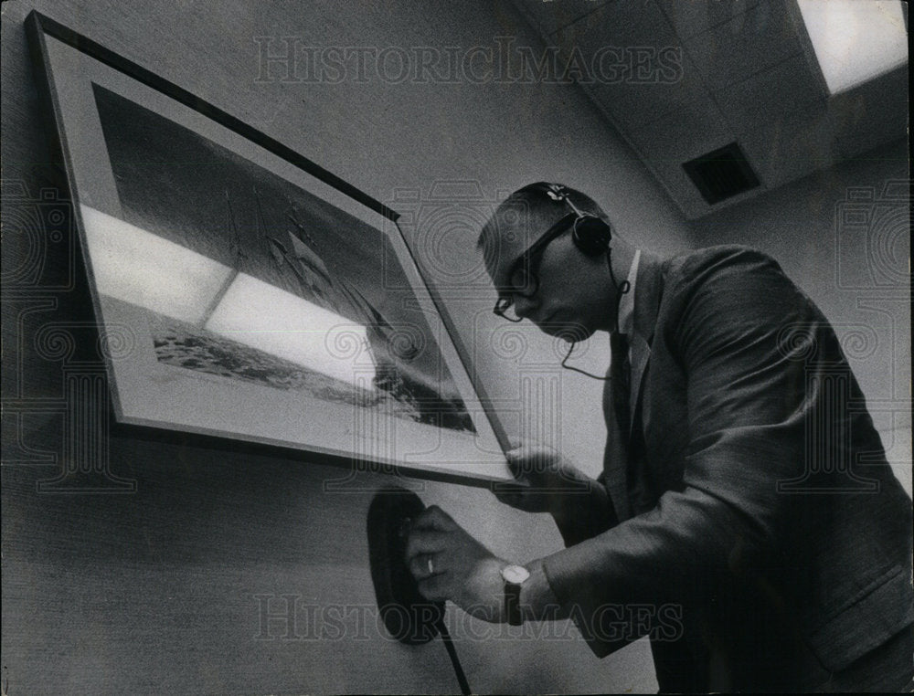 1967 Neil Anthony sweeps for bugging device - Historic Images