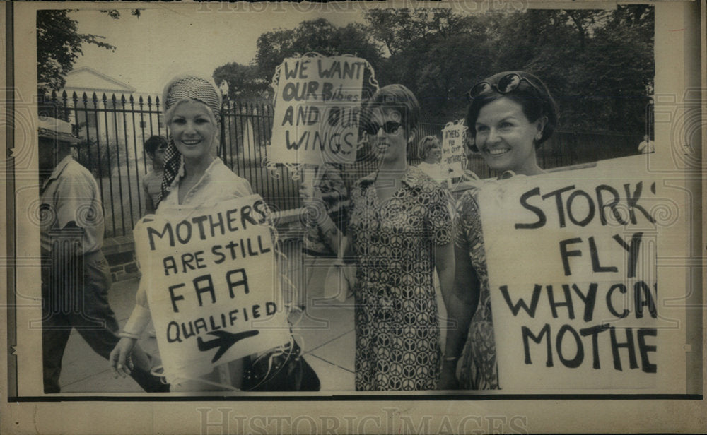 1970 Three airline stewardess in protest. - Historic Images