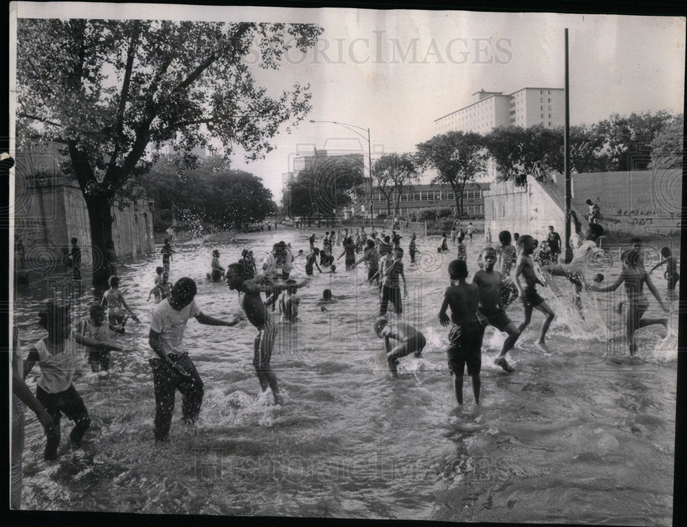 1968 Children playing with instant pool - Historic Images