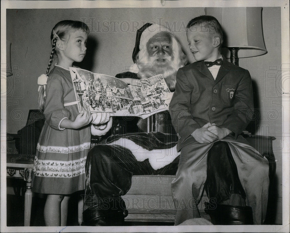 1961 Karen and Sam Brown get gifts from San - Historic Images