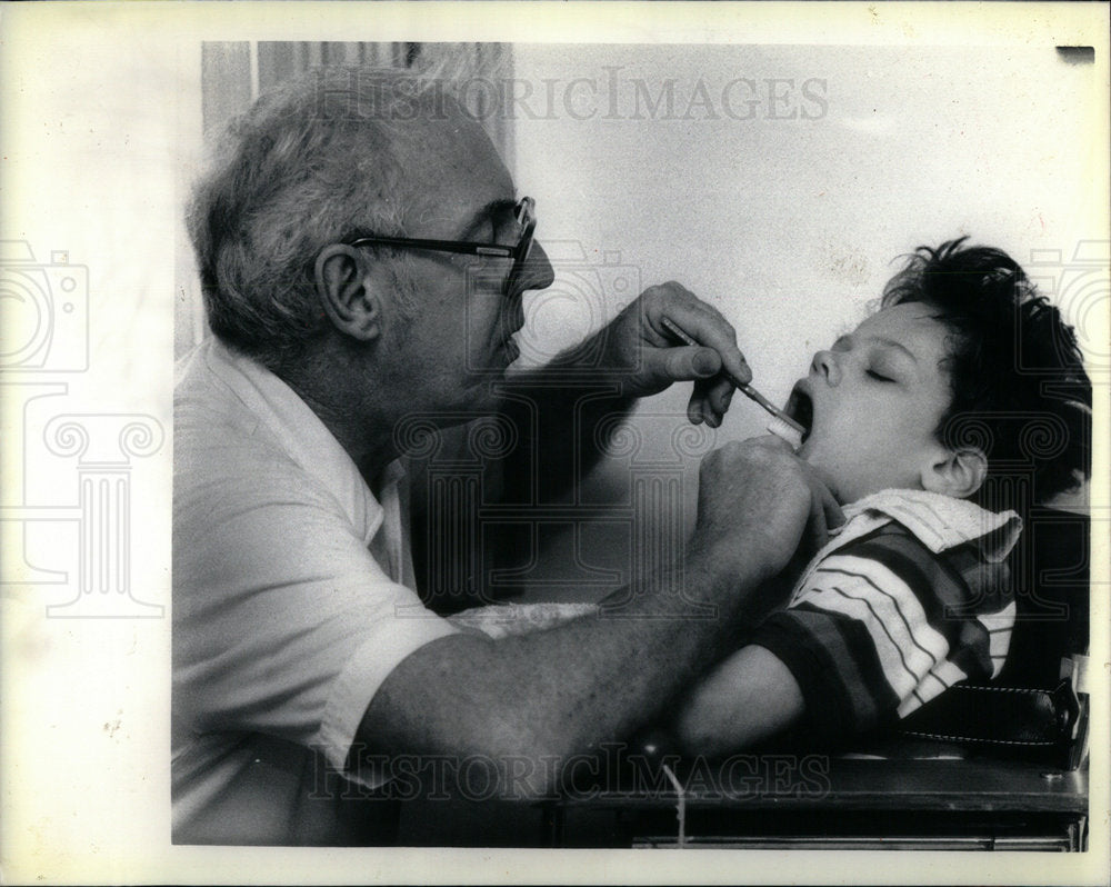 1987 Father Brushing Blind Sons Teeth - Historic Images