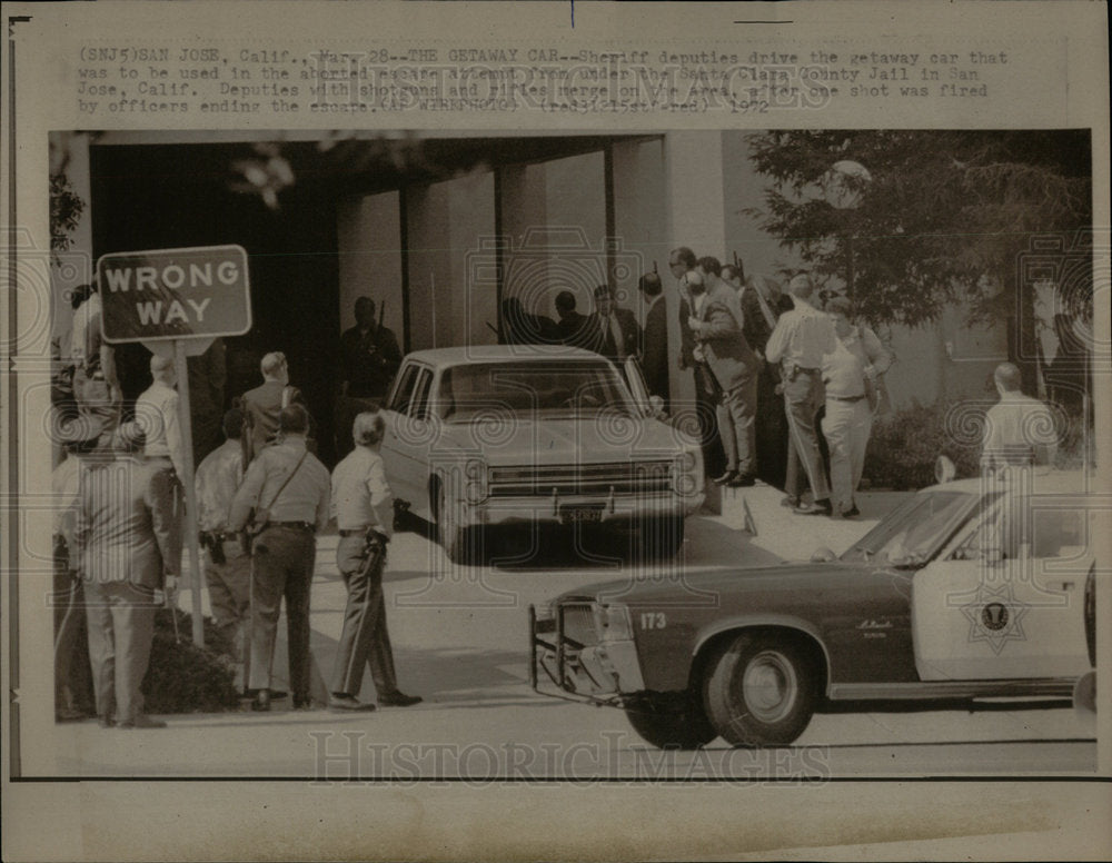 1972 Sheriff deputies drive the gateway car - Historic Images