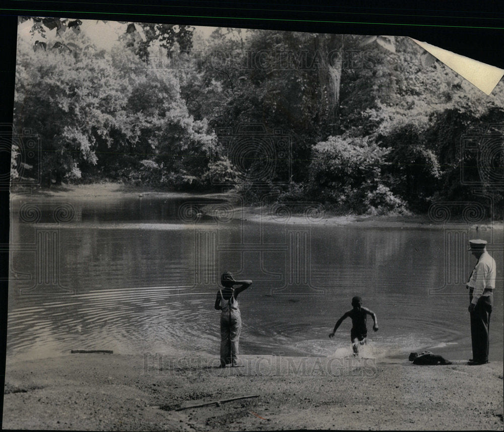 1957 Ranger John Byrnes Woods pond splashes - Historic Images