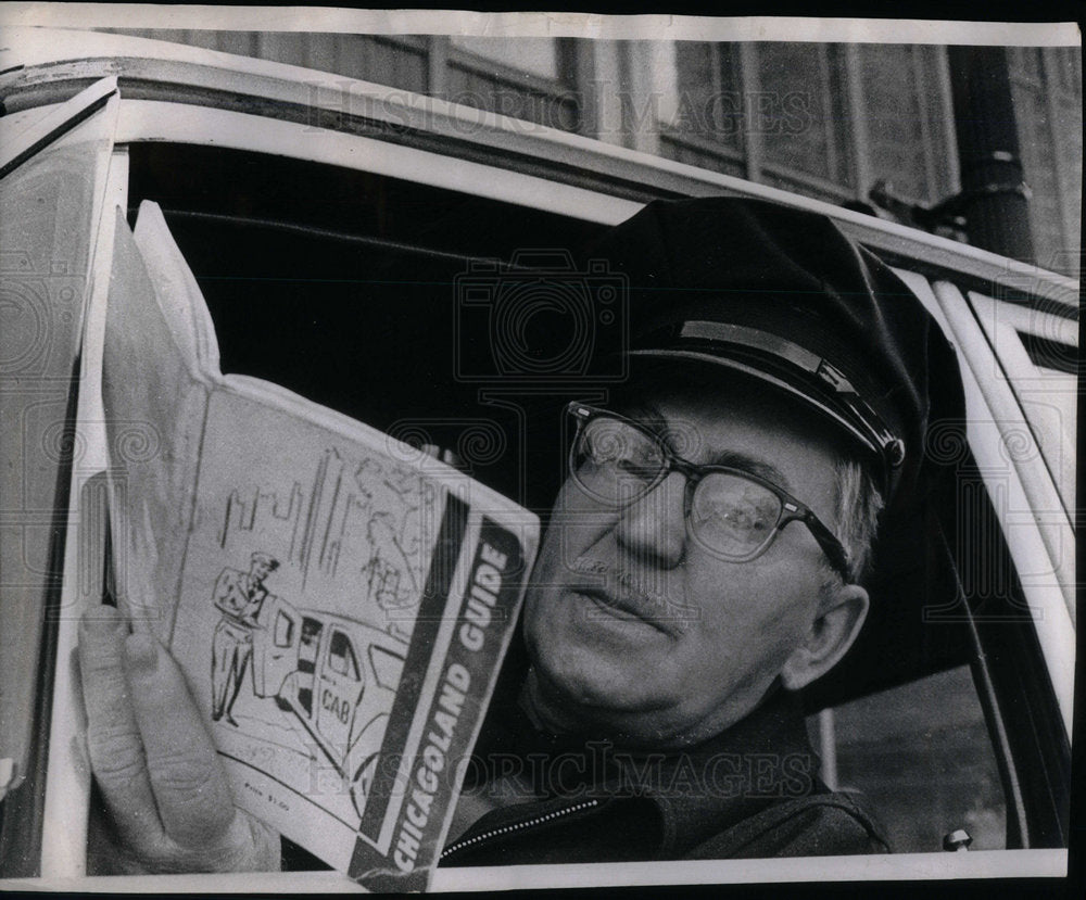 1967 Photo cab driver looking rates book - Historic Images