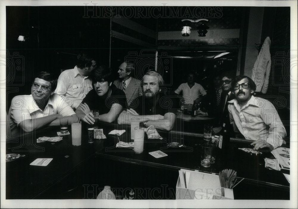 1979 Bar Patrons watch night football game - Historic Images