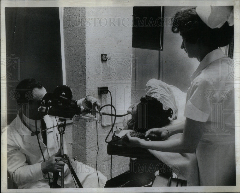 1964 Dr.Henry using new movie camera for di - Historic Images