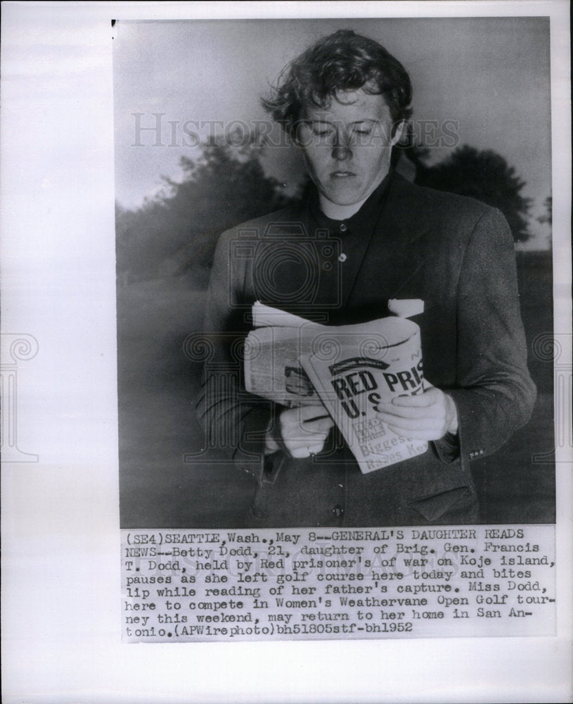 1952 Betty Dodd Brig Gen Rrancis Dodd reads - Historic Images