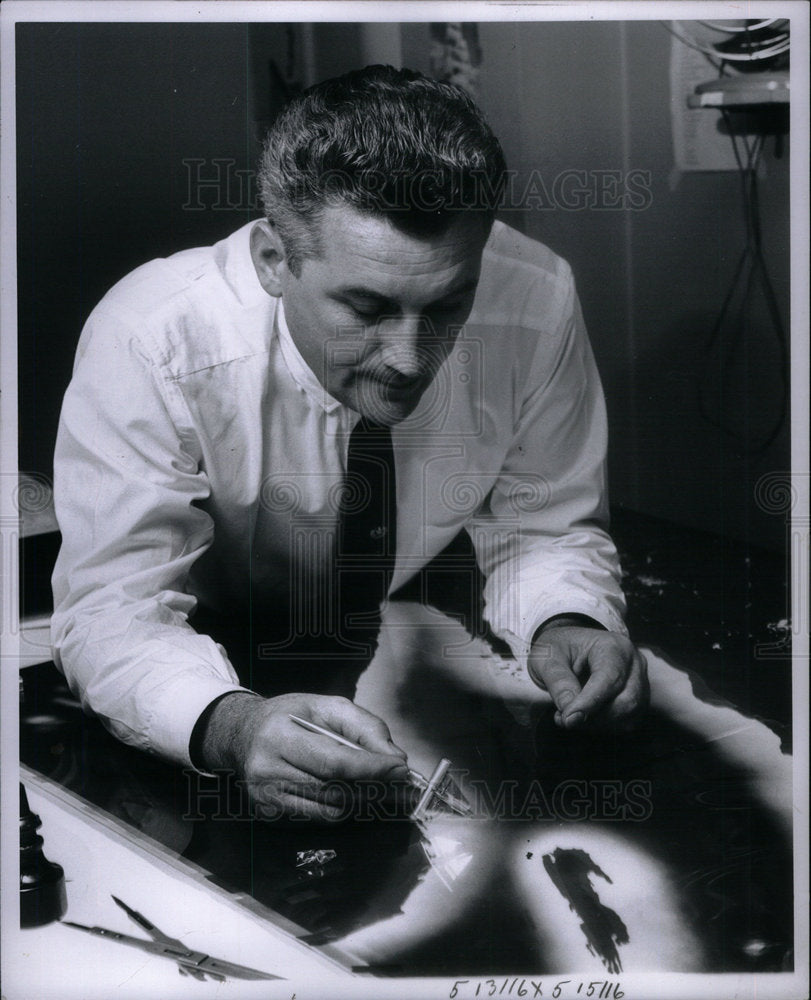 1961 Thomas Weakly working over light - Historic Images
