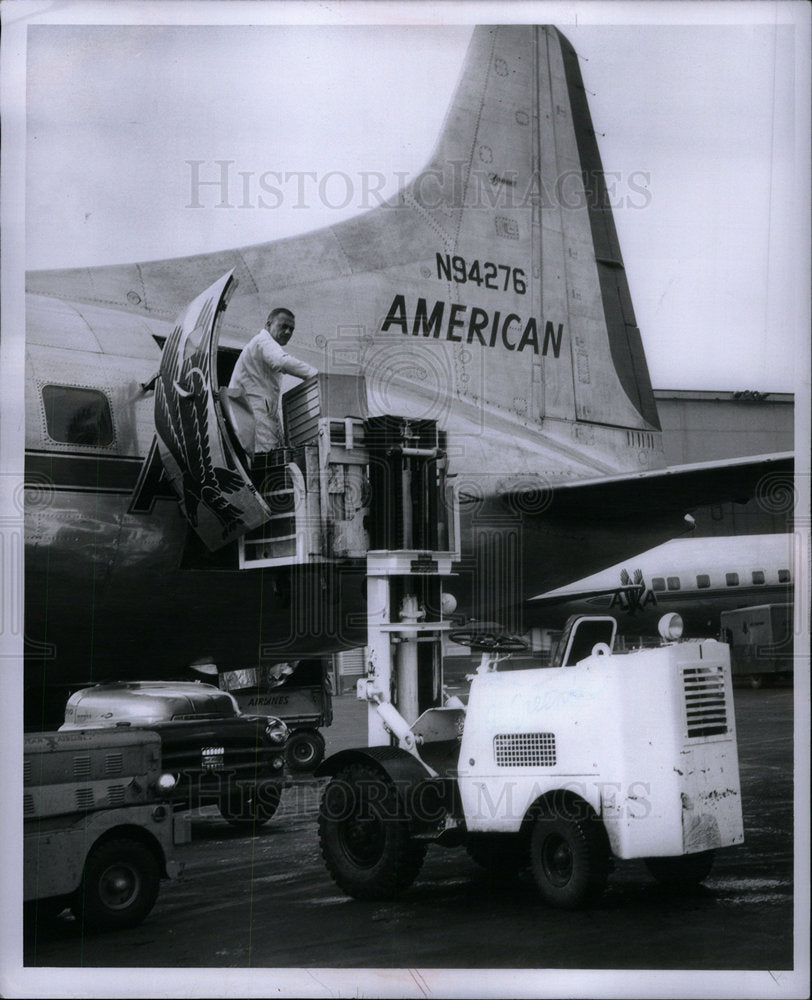 1956 Truck hoists onto airlines - Historic Images